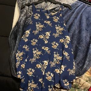 A nice shirt that has flowers and navy blue